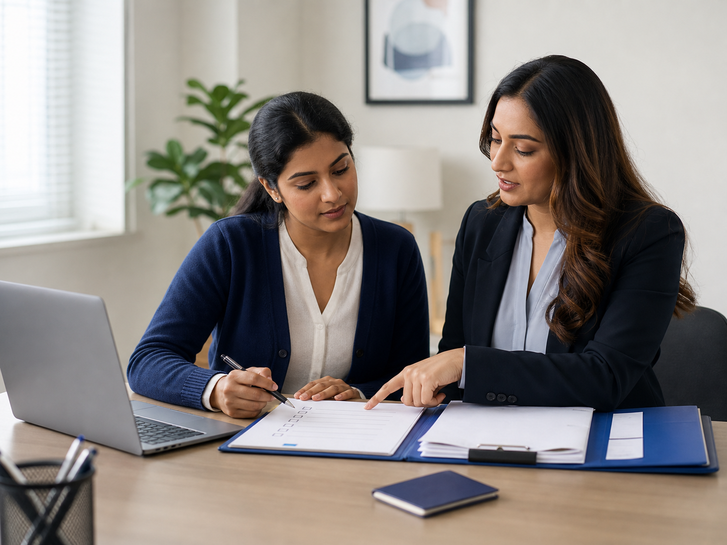 An Alfordz adviser going through a visa document checklist with a client, folder and passport on the desk